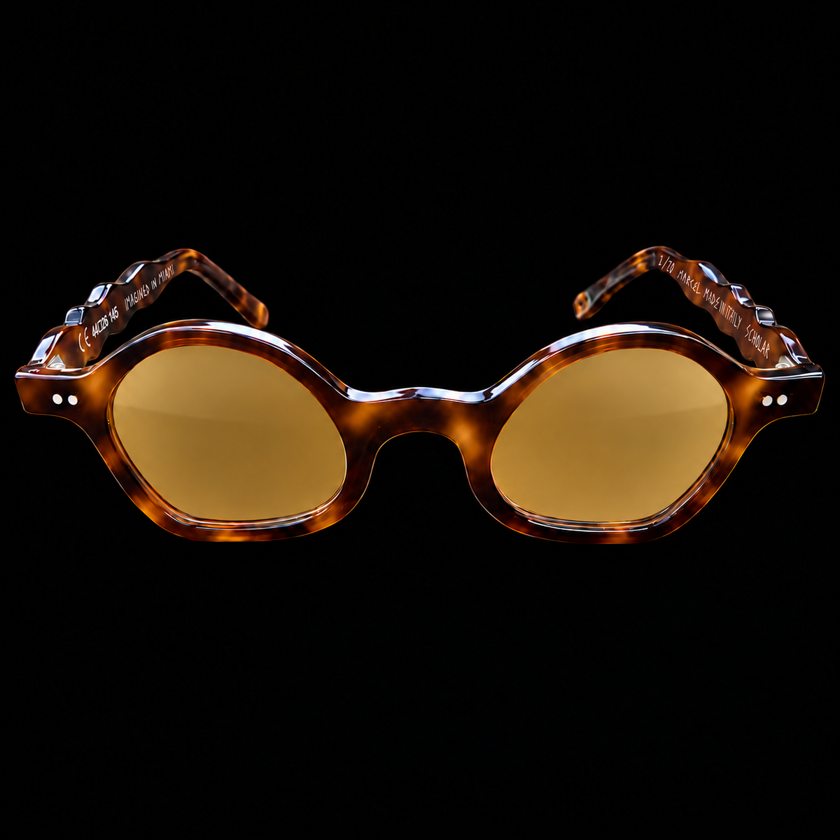 MARCEL Scholar Study 06220 brown tortoiseshell sunglasses with amber lenses, front view on black.