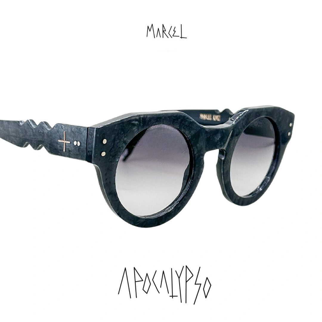 Sunglasses with a unique frame design on a white background, featuring the brand 'Marcel'. 3/4 front view.