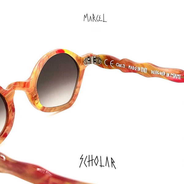 Sunglasses with a colorful frame and gradient lenses on a white background, featuring the brand 'Marcel'.