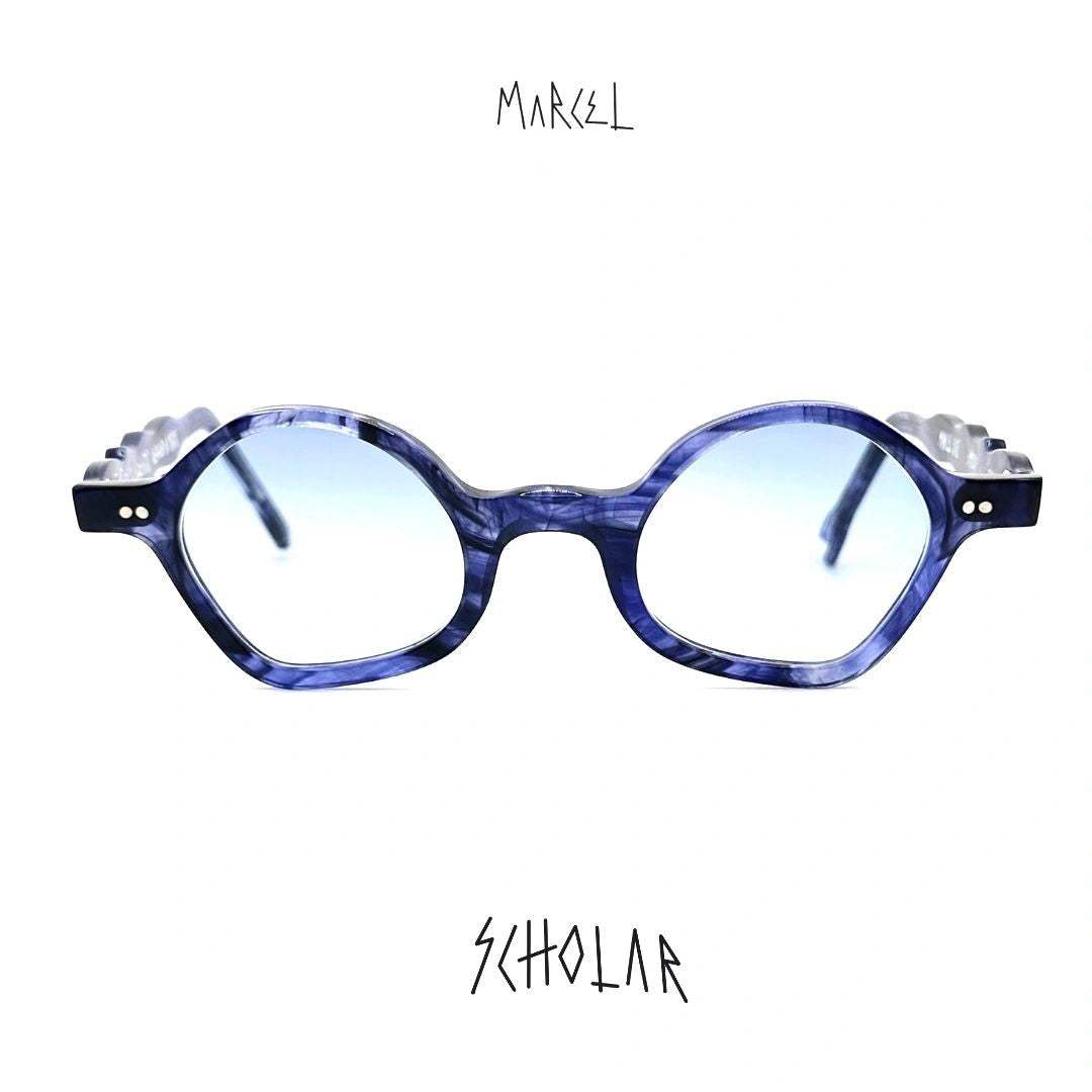 Blue eyeglasses with white accents on a white background, featuring the brand 'Marcel'. Front view.