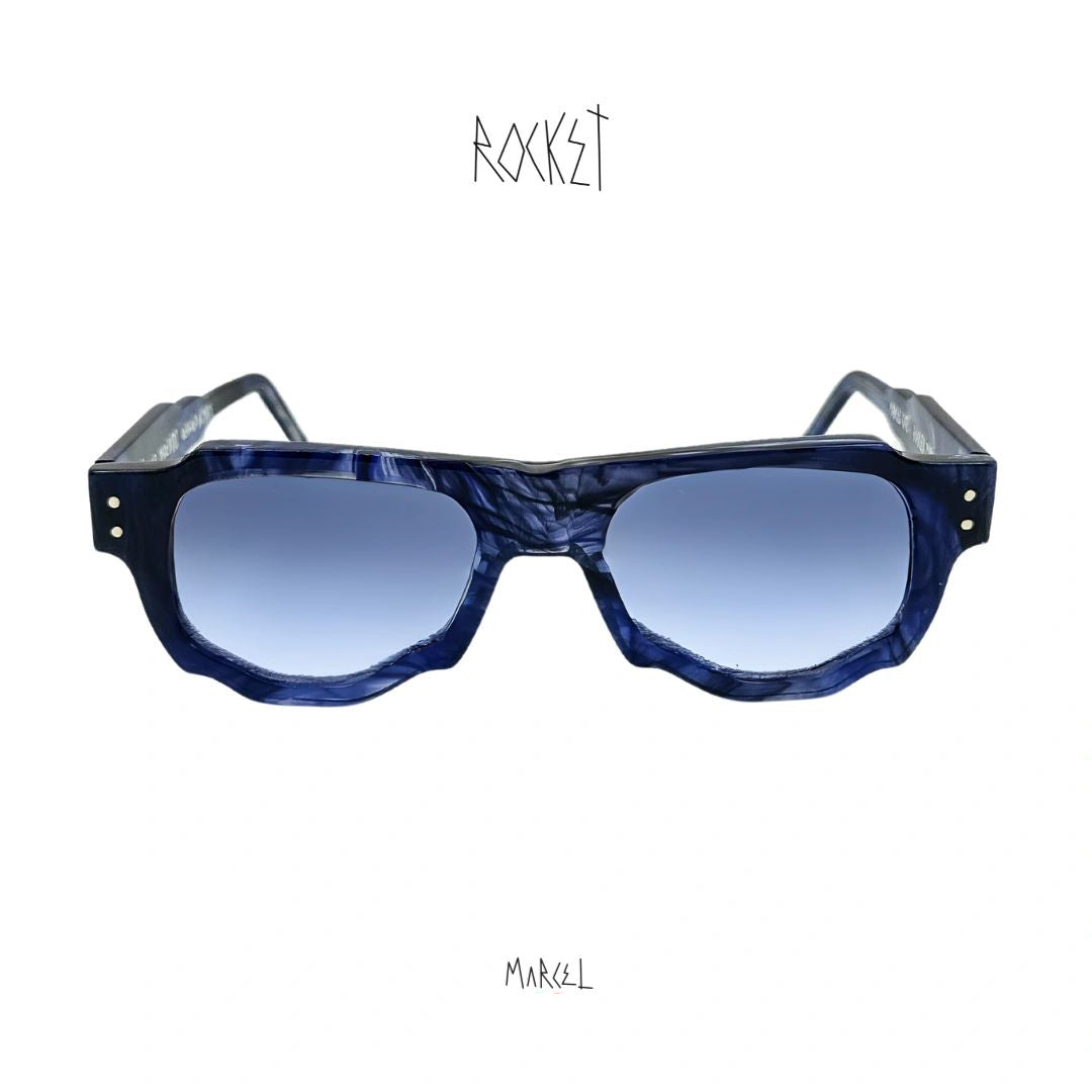 Blue sunglasses with a white background, featuring the brand 'Rocket' and 'Marcel'. Front view.