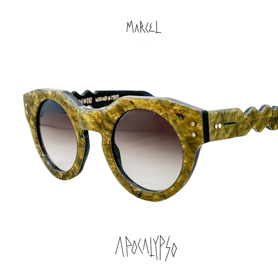 Sunglasses with a unique design on a white background, featuring the brand 'Marcel'. 3/4 front view.