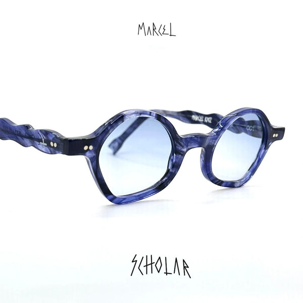 Blue eyeglasses with a twisted frame on a white background, featuring the brand 'Marcel'. 3/4 view.