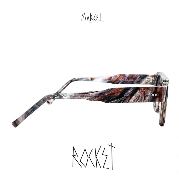 Marcel sunglasses with a marbled frame on a white background. Profile view.