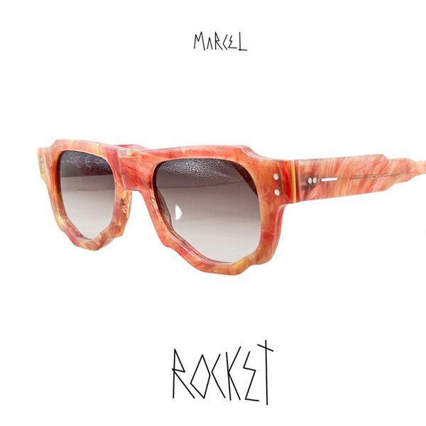 Marcel sunglasses with a red and orange frame on a white background. 3/4 view.