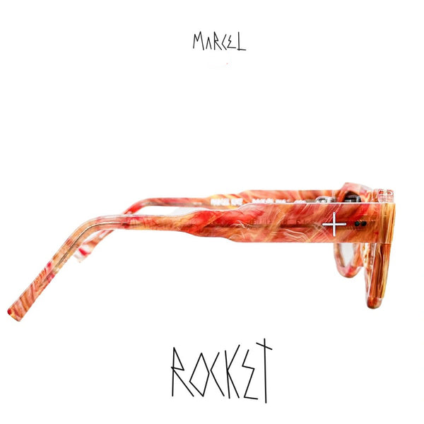 Marcel sunglasses with red and orange design on a white background. Profile view.