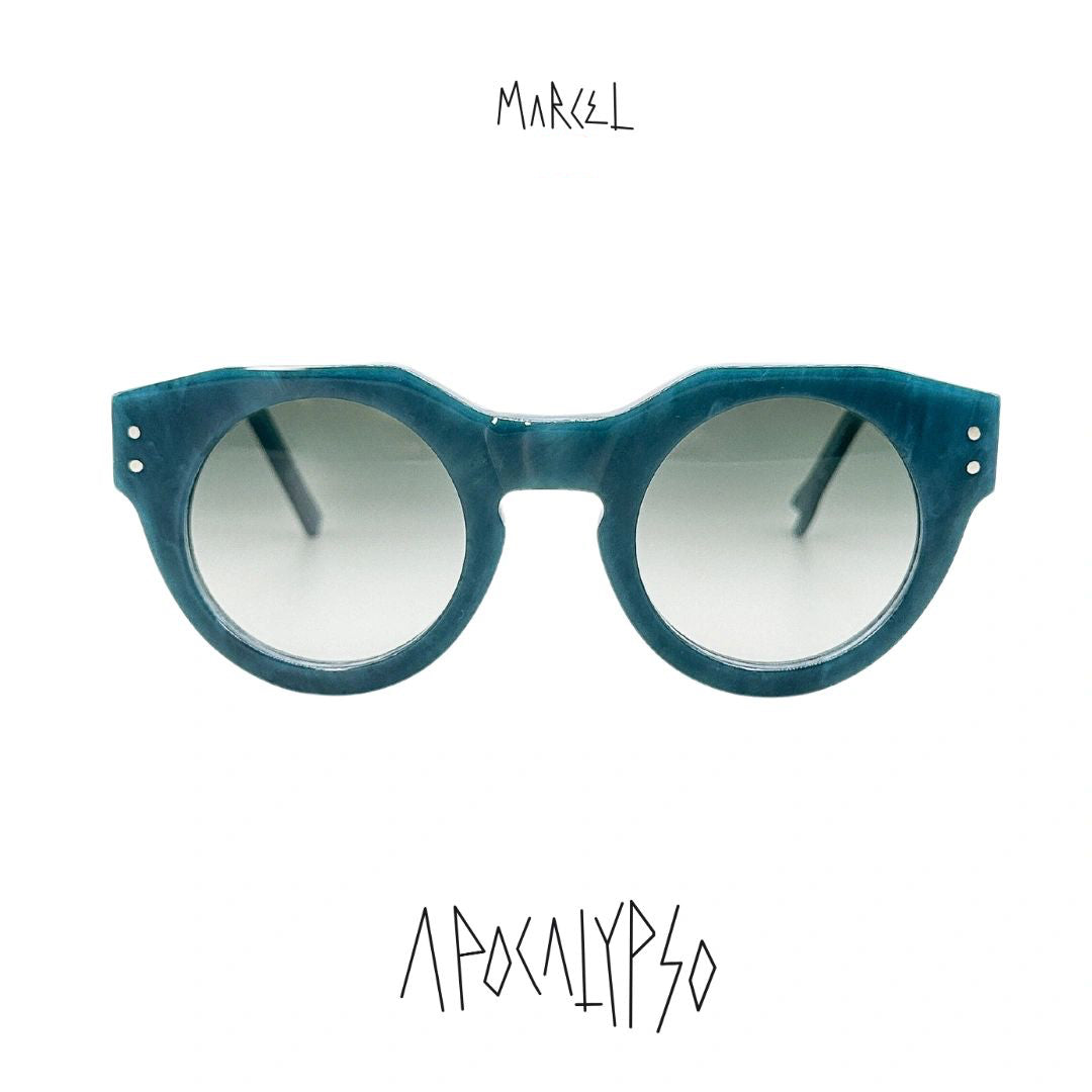 Blue sunglasses with gradient lenses on a white background, featuring the brand 'Marcel'. Front view.